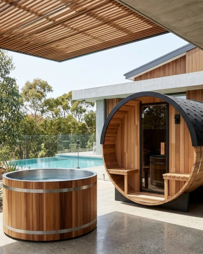 Barrel sauna and cedar tub side by side on a patio